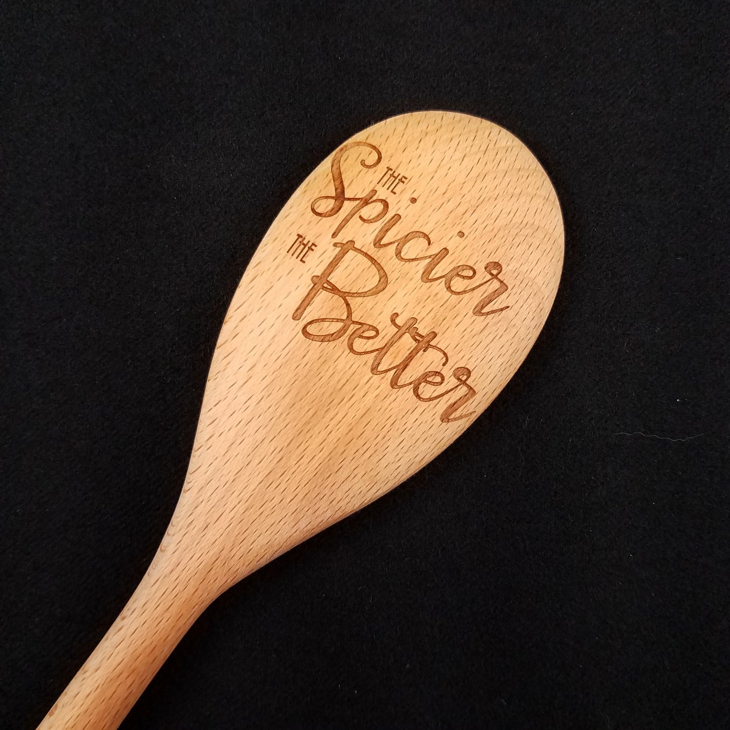 Beech wood spoon laser engraved with The Spicier The Better