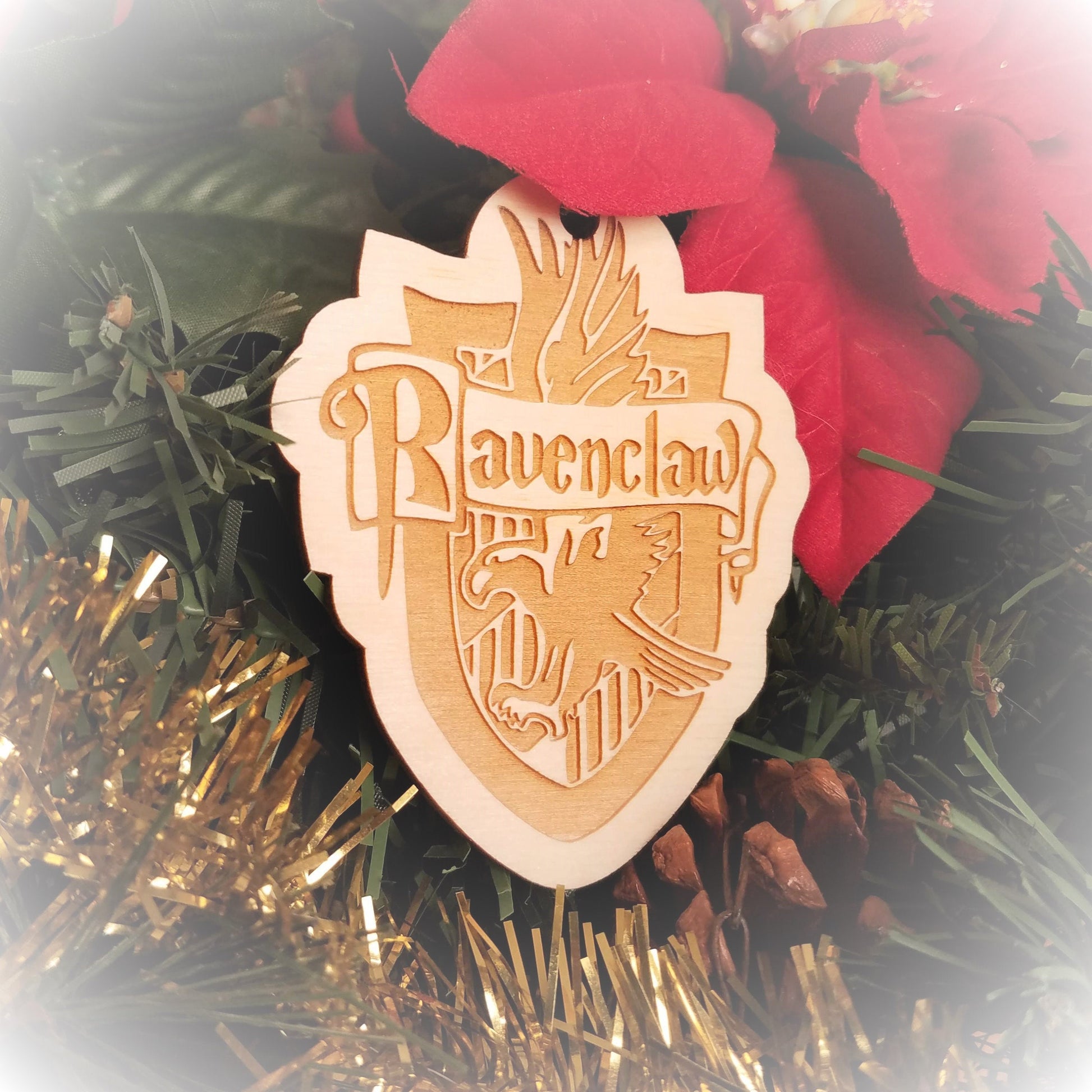 Laser engraved birch Christmas ornament with the Harry Potter Hogwarts House crest of Ravenclaw.