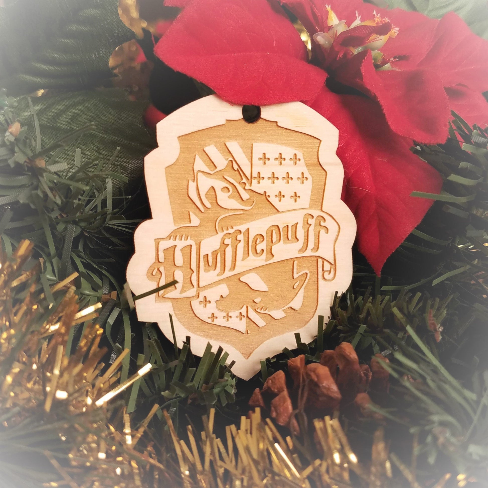 Laser engraved birch Christmas ornament with the Harry Potter Hogwarts House crest of Hufflepuff.