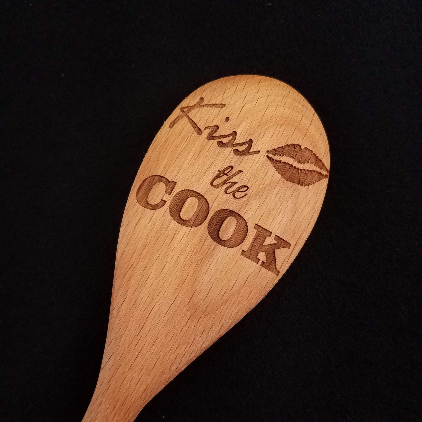 Beech wood spoon laser engraved with Kiss the Cook and a lip design