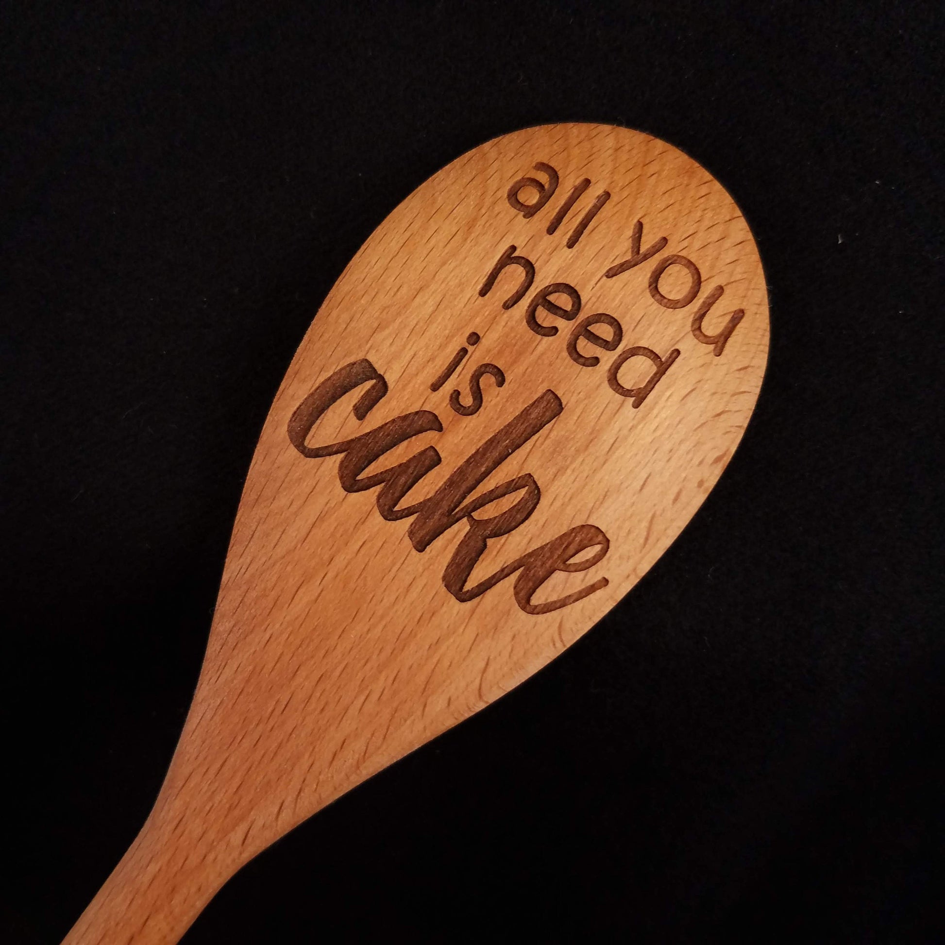 Beech wood spoon laser engraved with All You Need is Cake