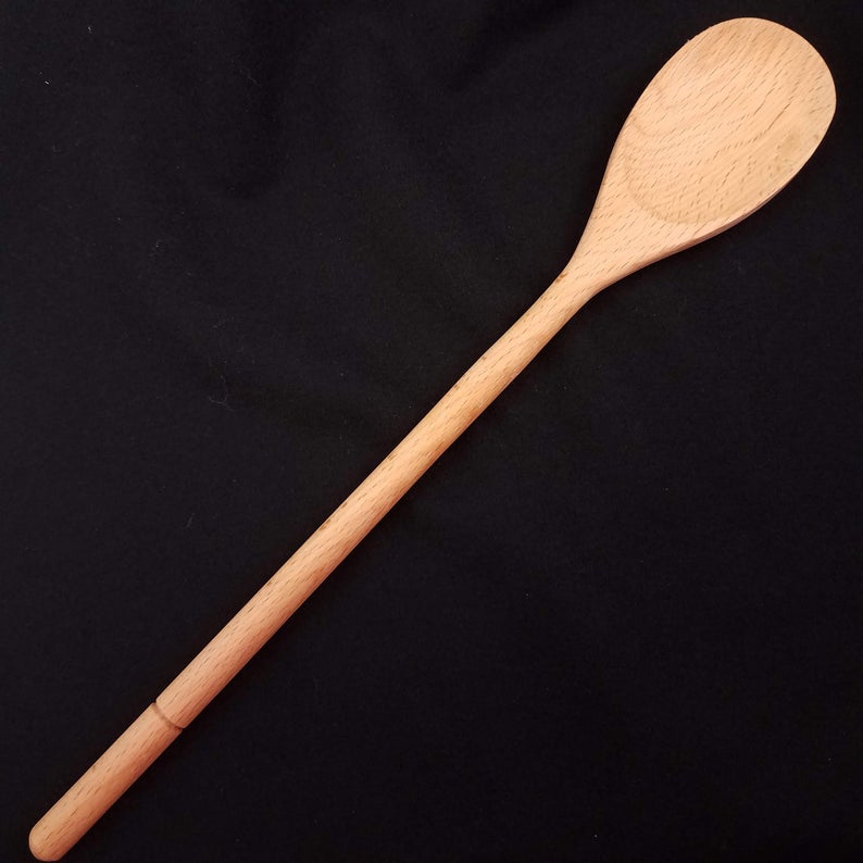 Beech wood spoon showing the overall shape and unengraved side